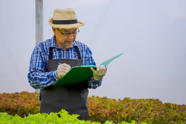 Farmer doing a checklist of his garden