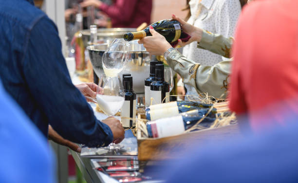 Hostess serving wine at wine fair event in Cape Town