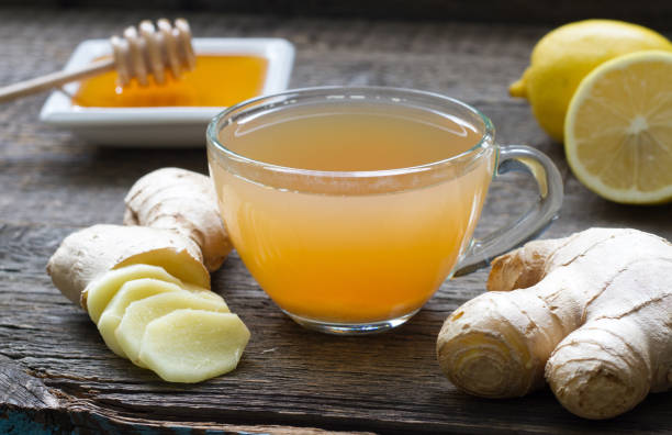 Ginger homemade tea infused with ginger slices and honey