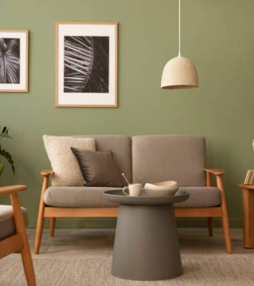 Olive green wall paired with brown toned couches