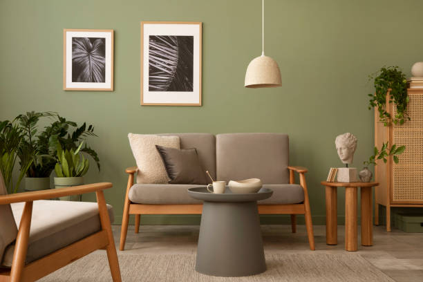 Olive green wall paired with brown toned couches