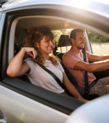 Young couple shares lighthearted moments and laughter during their adventurous car journey