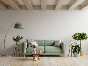 Green sofa in modern apartment interior with empty wall and wooden table,3D rendering