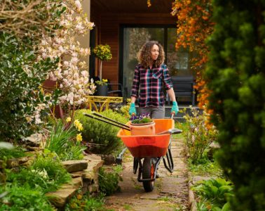 woman taking her tools down the garden