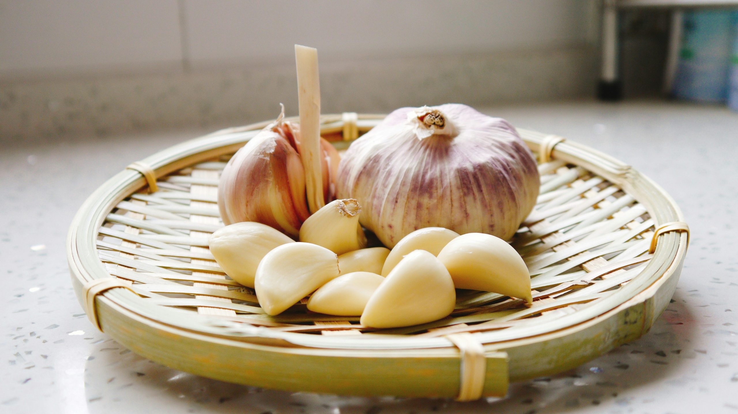 Garlic on top of handmade basket tray