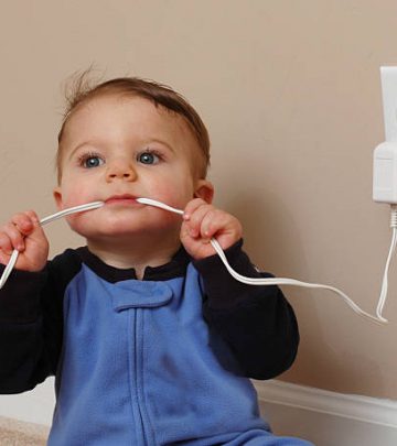 baby boy chews on an electrical cord.