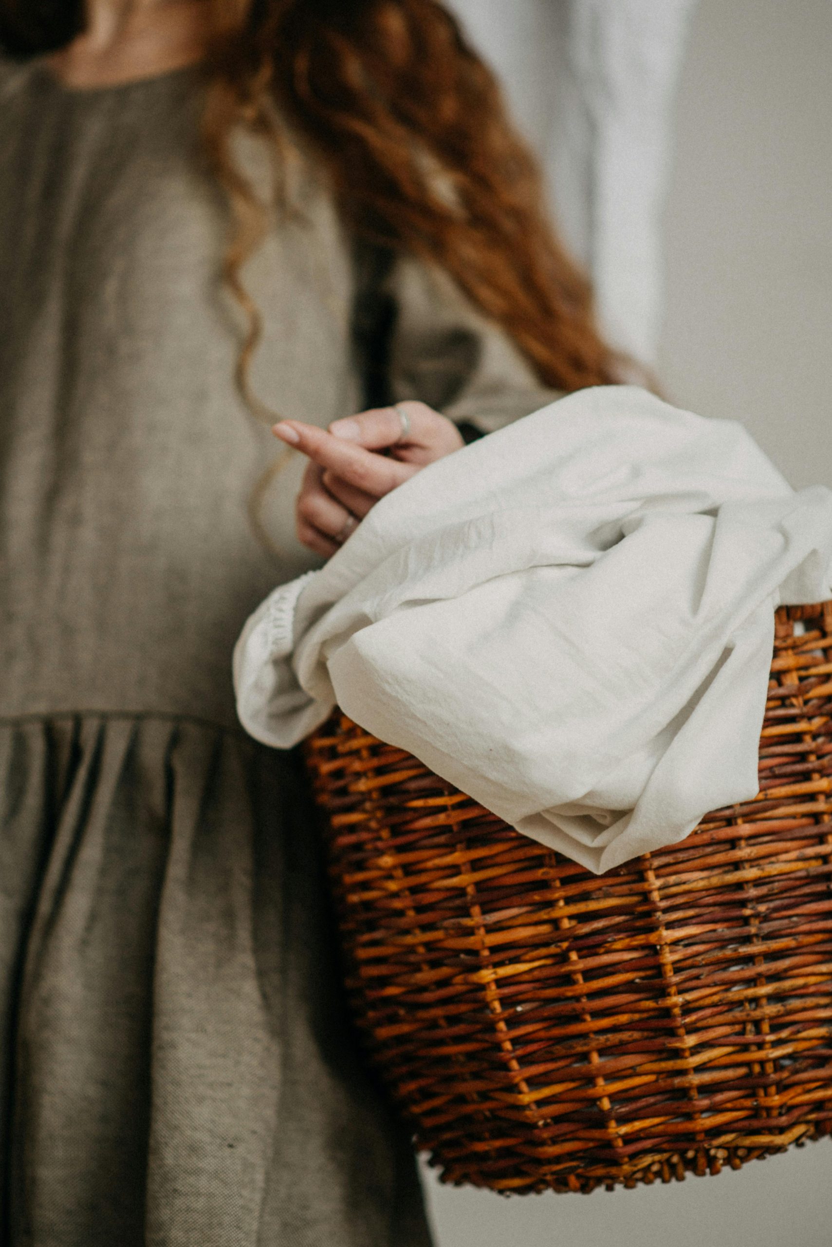 Linen items in a brown basket 